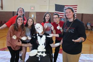 Dr. Bullard gets a pie thrown in his face during Parent's Day