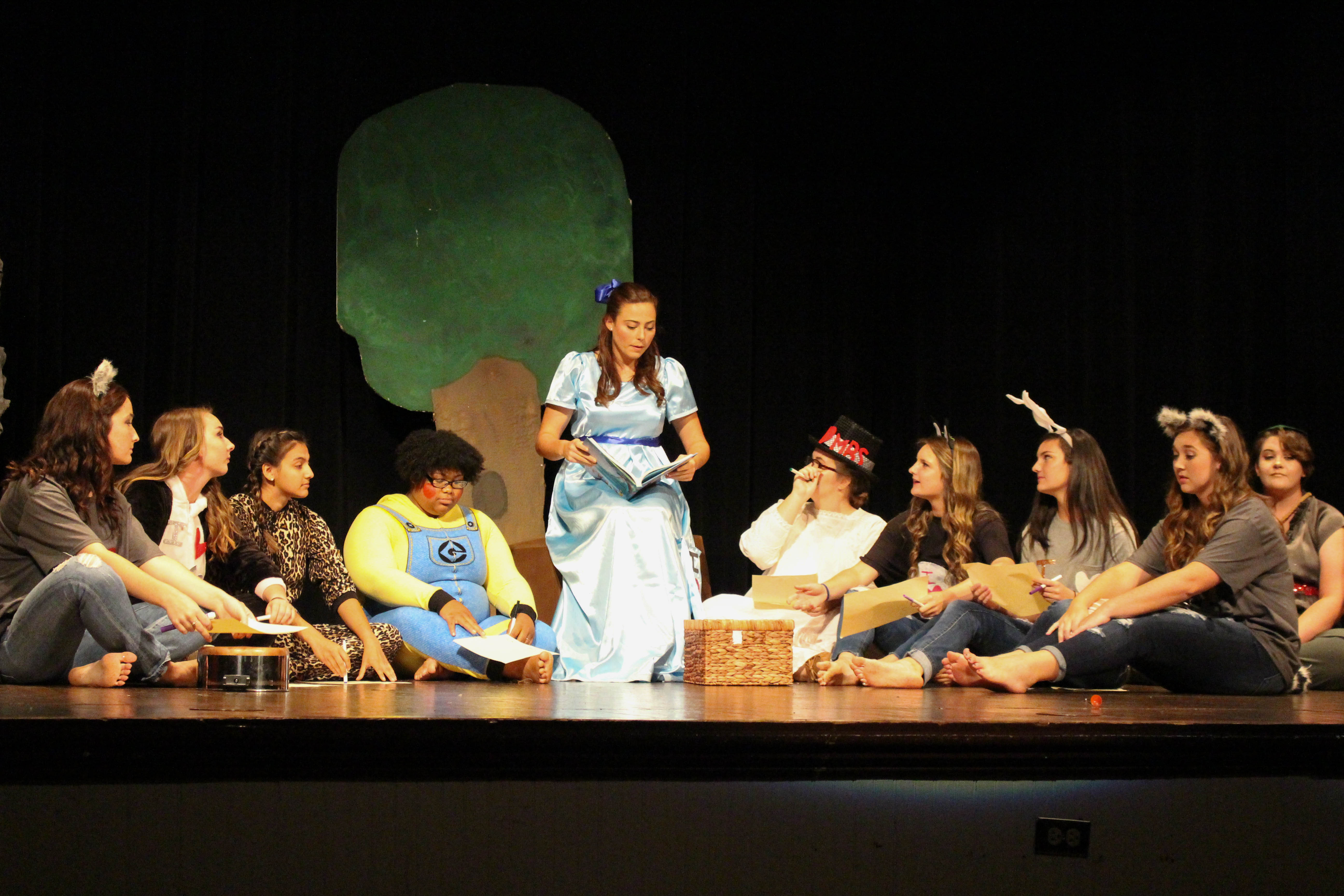 Wendy Darling (Amanda Rowley) reading a story to the Lost Boys. Photo by Judson College.